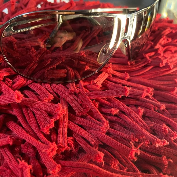 Sunglasses by Prada - Picture 1 of 8